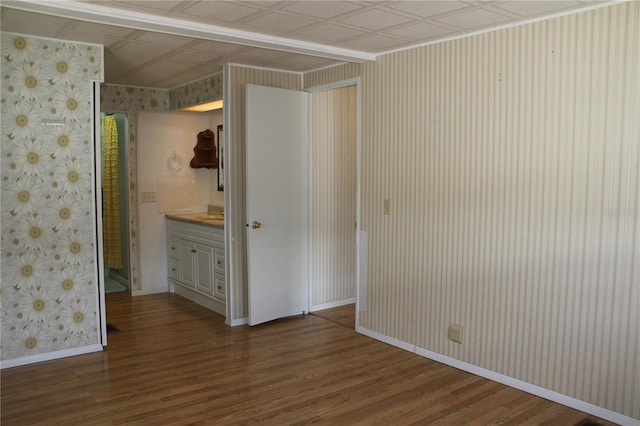 spare room featuring dark wood-type flooring