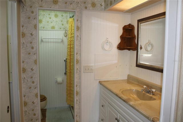 bathroom with vanity and toilet