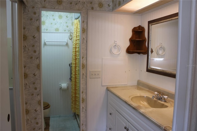 bathroom featuring vanity and toilet