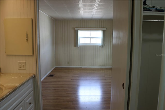 unfurnished room with hardwood / wood-style floors