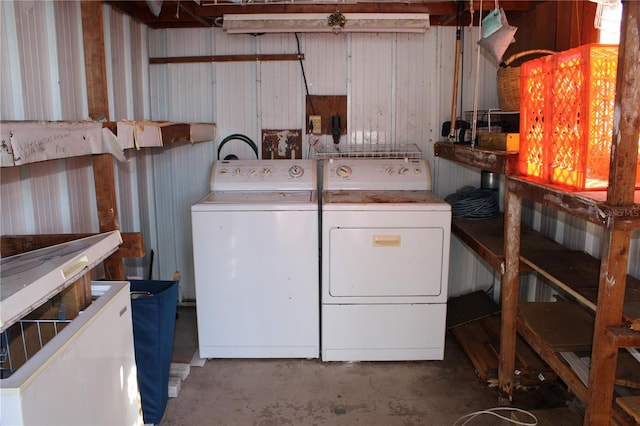 laundry area with washing machine and clothes dryer