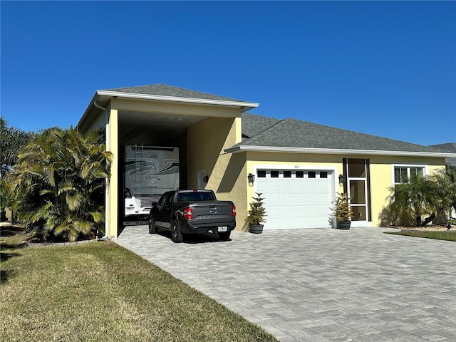 view of front facade with a garage and a front lawn