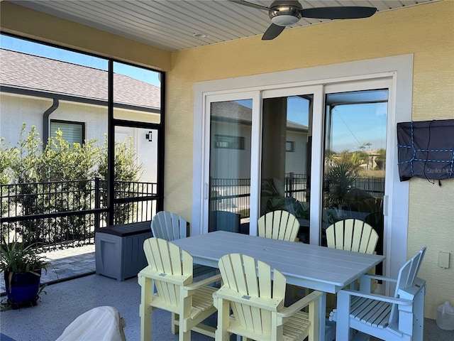 sunroom featuring ceiling fan