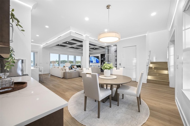 dining area with light hardwood / wood-style floors