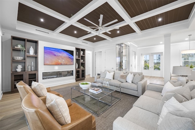 living room featuring coffered ceiling, french doors, beamed ceiling, and wood ceiling