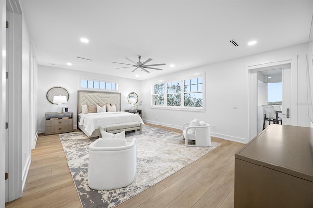 bedroom with light wood-type flooring and ceiling fan