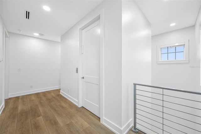 corridor featuring light wood-type flooring