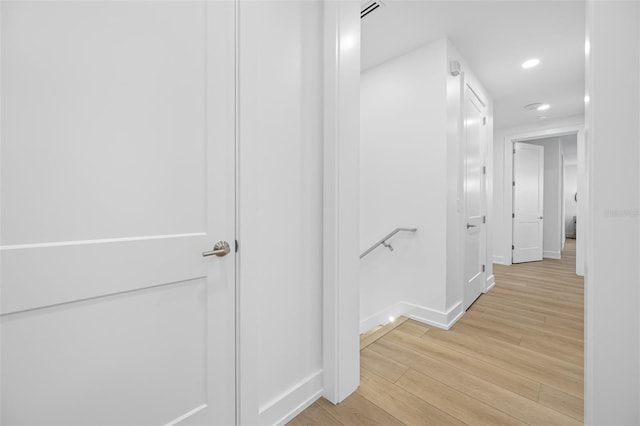 hallway featuring light hardwood / wood-style flooring