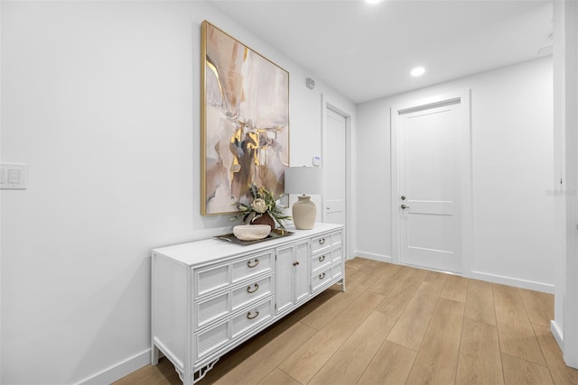 hall with light wood-type flooring