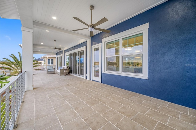 view of patio featuring ceiling fan