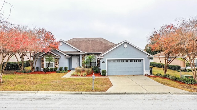 view of front facade with a garage and a front yard