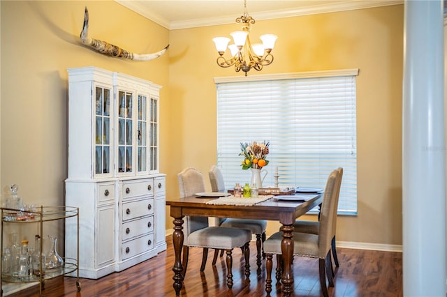 dining room with crown molding, dark hardwood / wood-style floors, and a chandelier