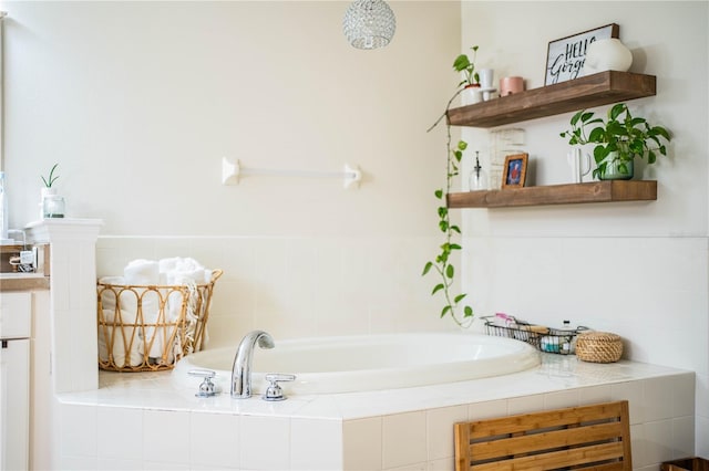 bathroom featuring a relaxing tiled tub