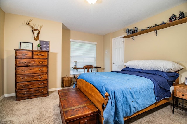 bedroom with light colored carpet