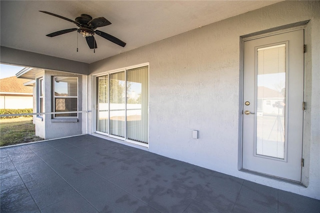 exterior space with ceiling fan