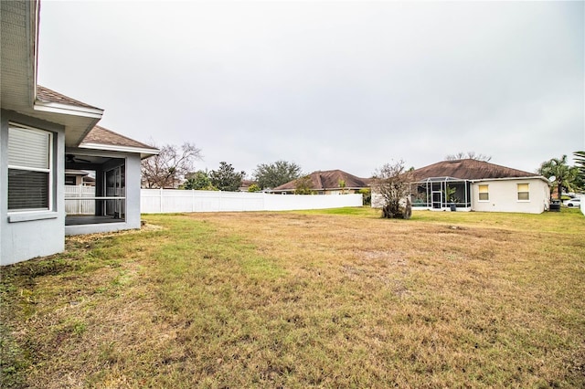 view of yard with a sunroom