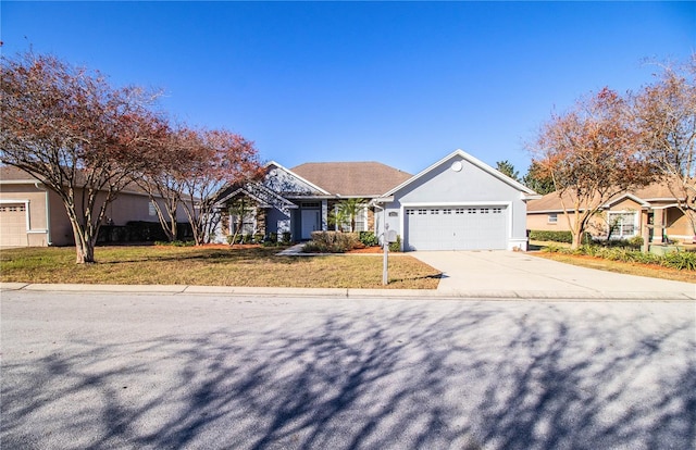 single story home featuring a garage and a front lawn