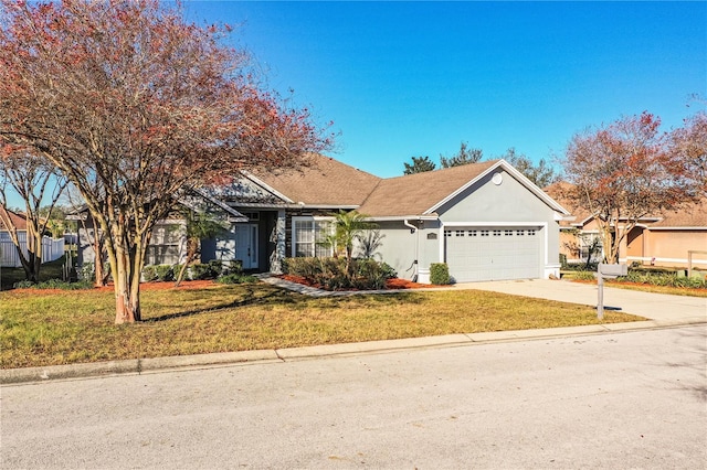 view of front of home featuring a garage and a front lawn