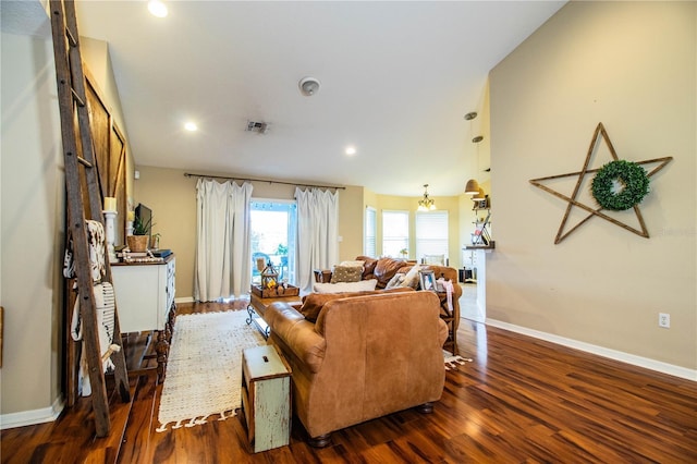 living room with wood finished floors, baseboards, visible vents, and recessed lighting