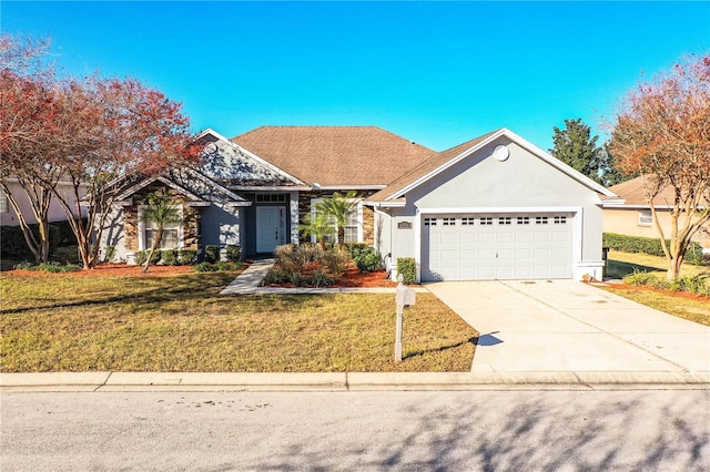 view of front of house with a garage, a front yard, stucco siding, and concrete driveway