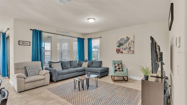 living room featuring light tile patterned floors