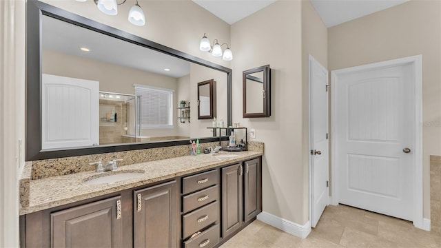 bathroom featuring vanity, an enclosed shower, and tile patterned flooring