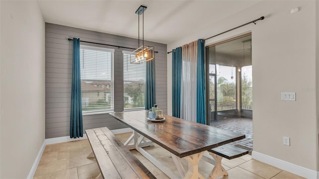 dining area with light tile patterned floors