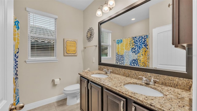 bathroom with vanity, toilet, a shower with shower curtain, and tile patterned flooring