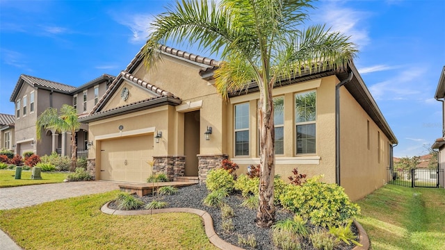 mediterranean / spanish house featuring a front yard