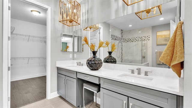 bathroom featuring an enclosed shower, vanity, and tile patterned floors