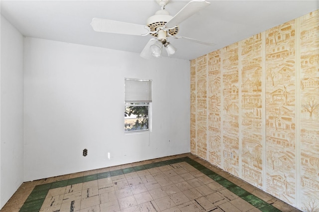 unfurnished room with ceiling fan