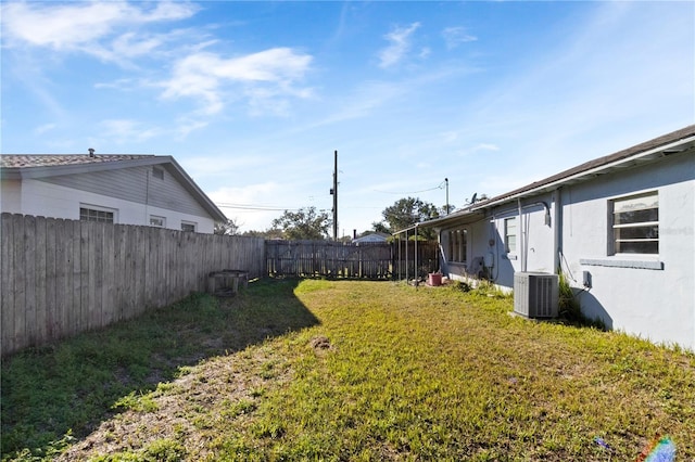 view of yard featuring central air condition unit