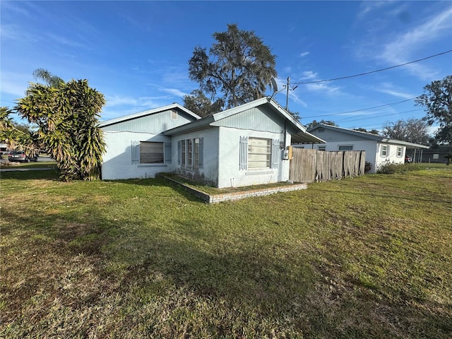 view of home's exterior featuring a lawn