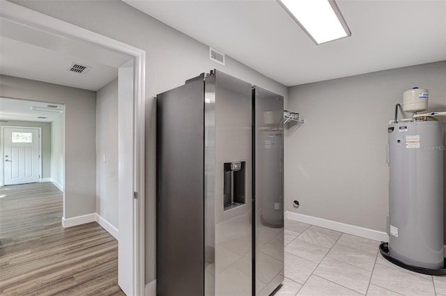 interior space with washer and dryer and electric water heater