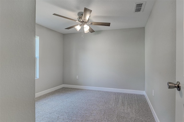 unfurnished room featuring ceiling fan and carpet flooring