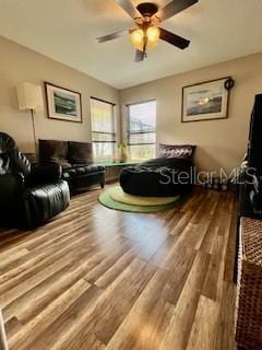 interior space with hardwood / wood-style flooring and ceiling fan