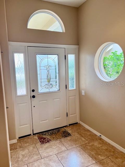 entrance foyer featuring light tile patterned floors