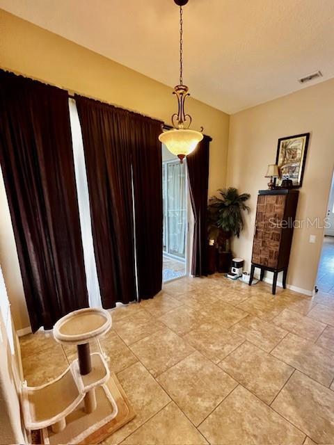 living area with light tile patterned floors