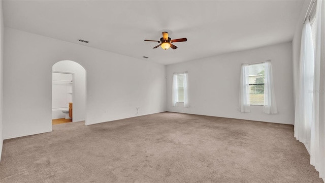 carpeted empty room featuring ceiling fan