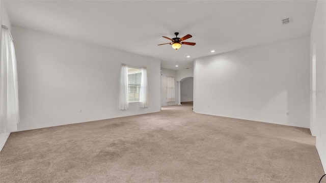 carpeted empty room with ceiling fan