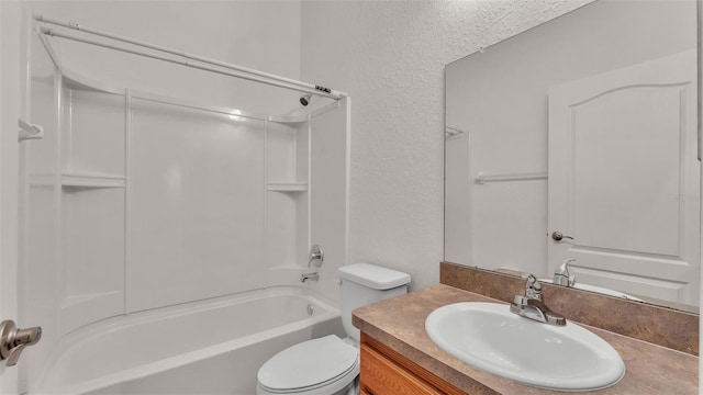 full bathroom with shower / bathing tub combination, vanity, and toilet