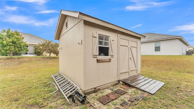 view of outdoor structure with a lawn