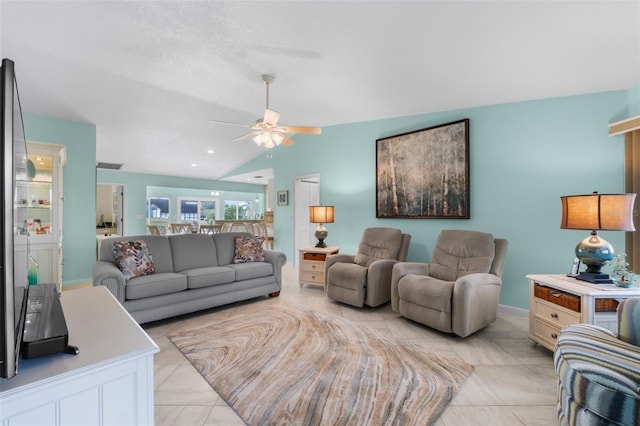 living room featuring vaulted ceiling and ceiling fan