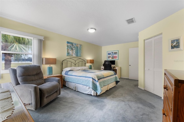 carpeted bedroom featuring a closet