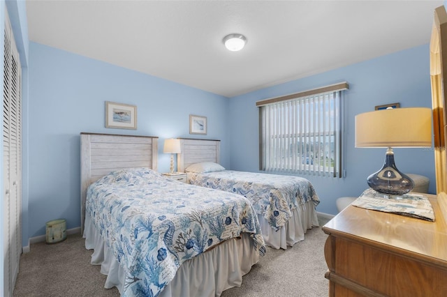 carpeted bedroom featuring a closet