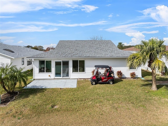 back of house featuring a patio and a lawn