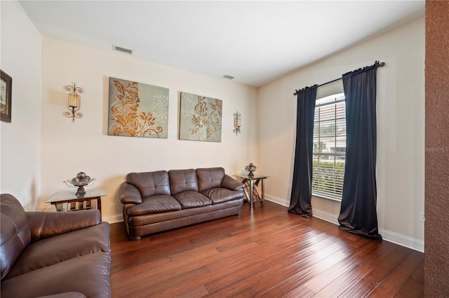 living room with dark hardwood / wood-style flooring