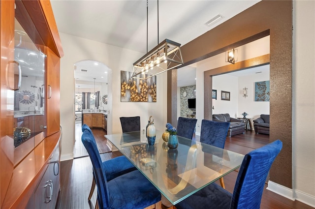 dining area with dark hardwood / wood-style floors