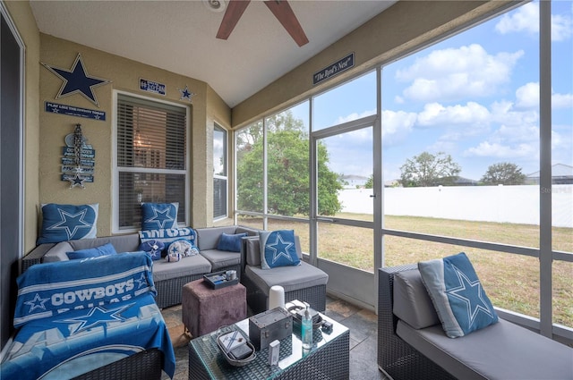 sunroom / solarium featuring ceiling fan