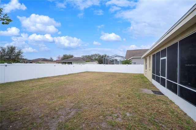 view of yard with a sunroom